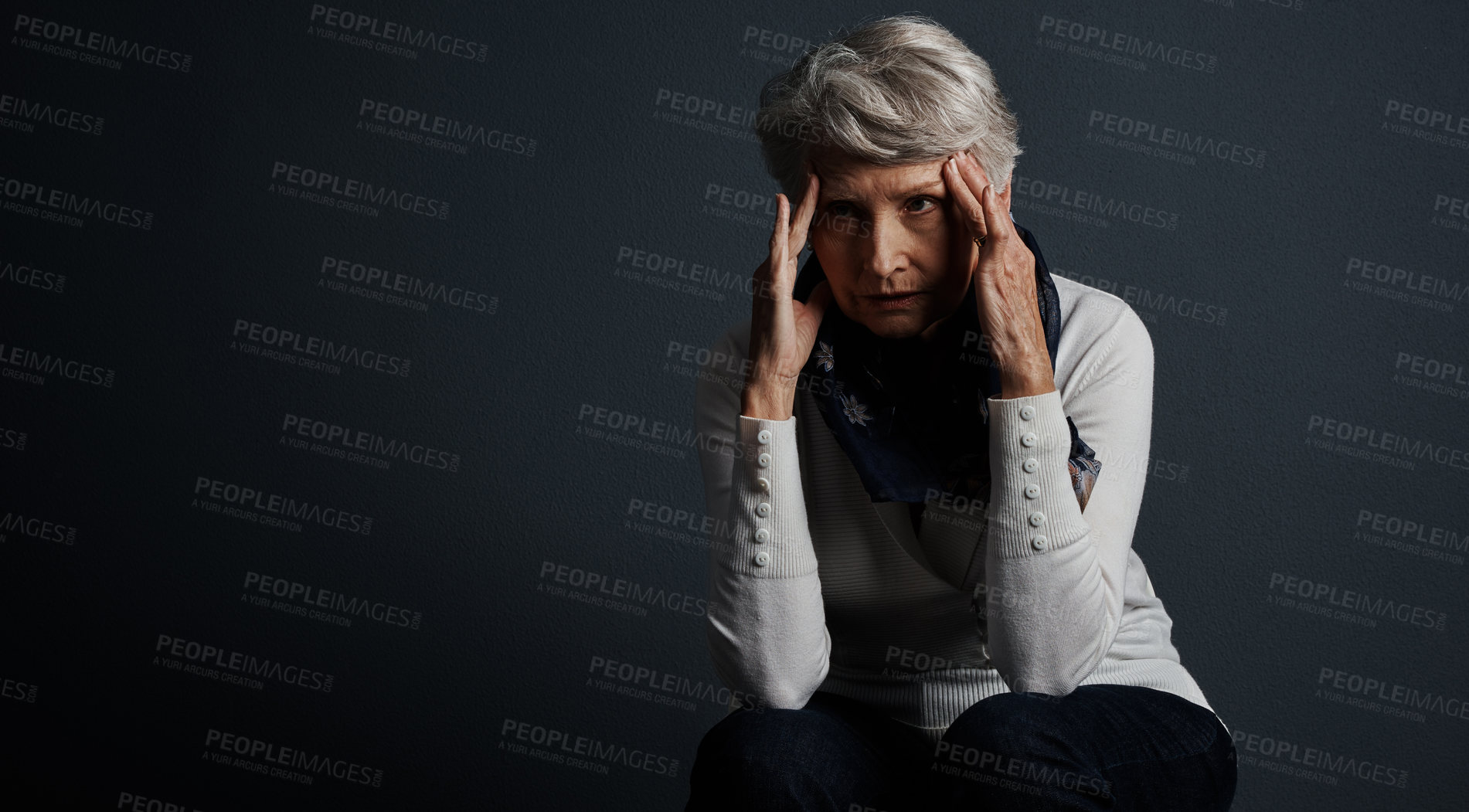 Buy stock photo Studio shot of a stressed out elderly woman sitting down with her eyes closed and contemplating