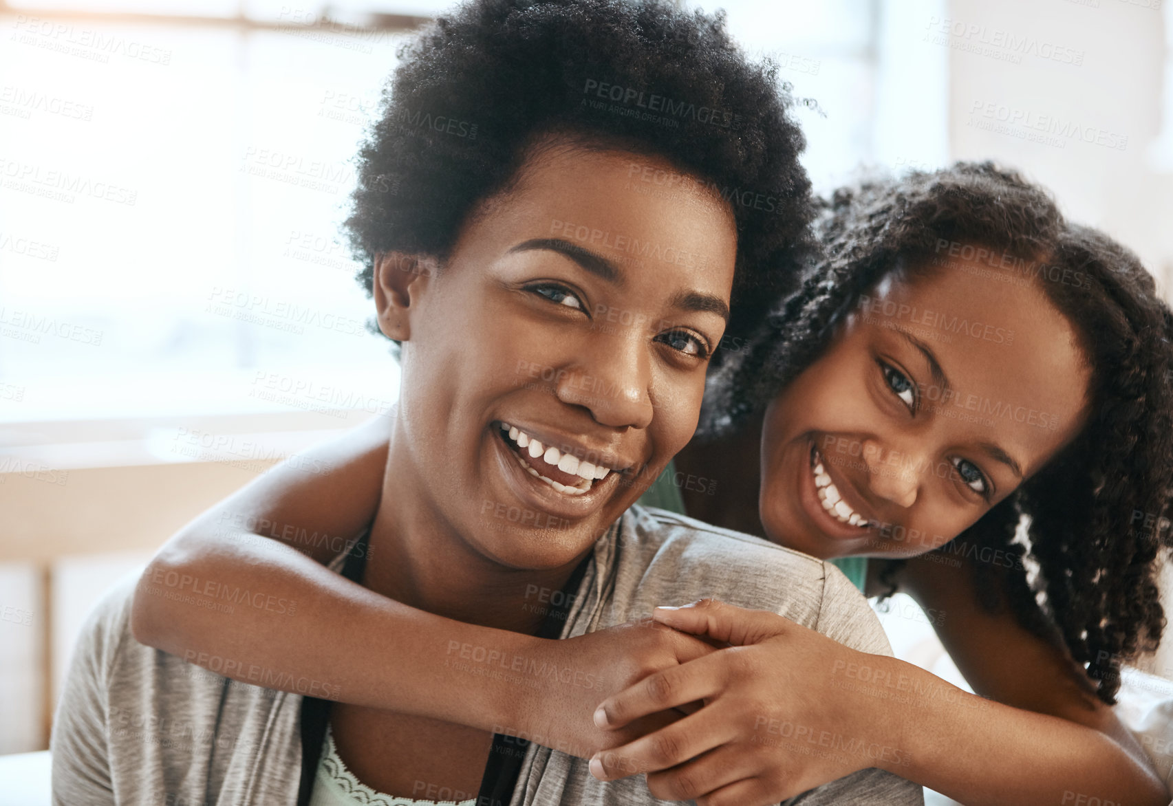 Buy stock photo Hug, laugh and portrait of mother with child in home for bonding, relationship and relax on weekend. Black family, happy and mom with girl embrace on sofa for affection, love and care in living room