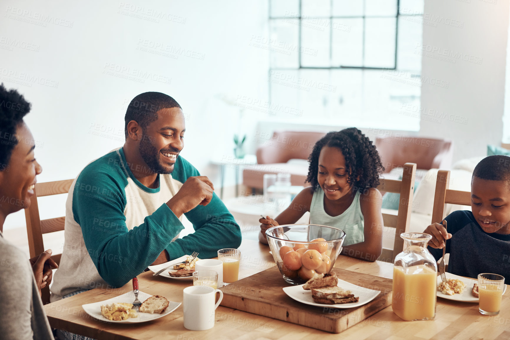 Buy stock photo Shot of a family having breakfast together at home