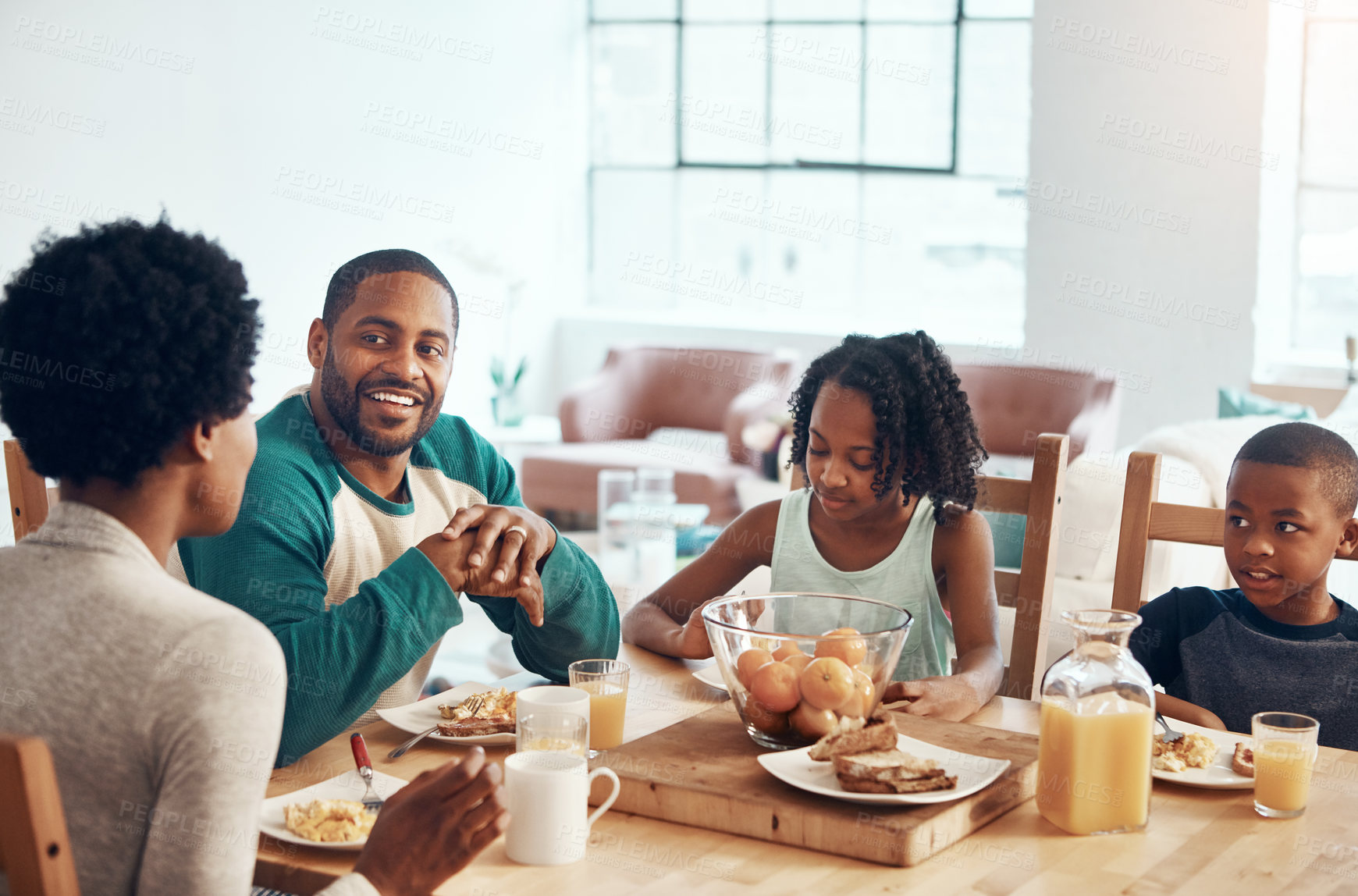 Buy stock photo Black family, parents and children for breakfast in morning with eating, bonding and happy in dining room. Love, mother and father with kids with food, eggs and bread for nutrition and hungry in home