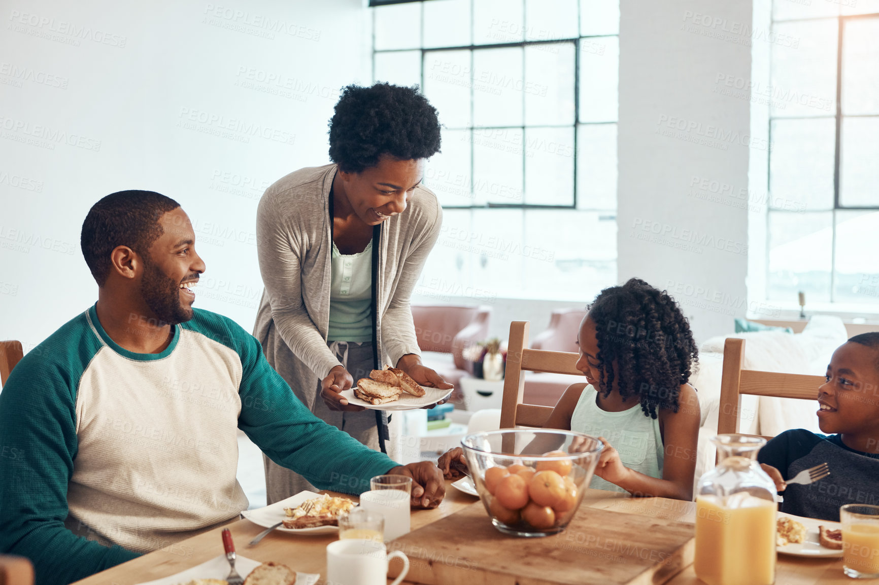 Buy stock photo Shot of a family having breakfast together at home