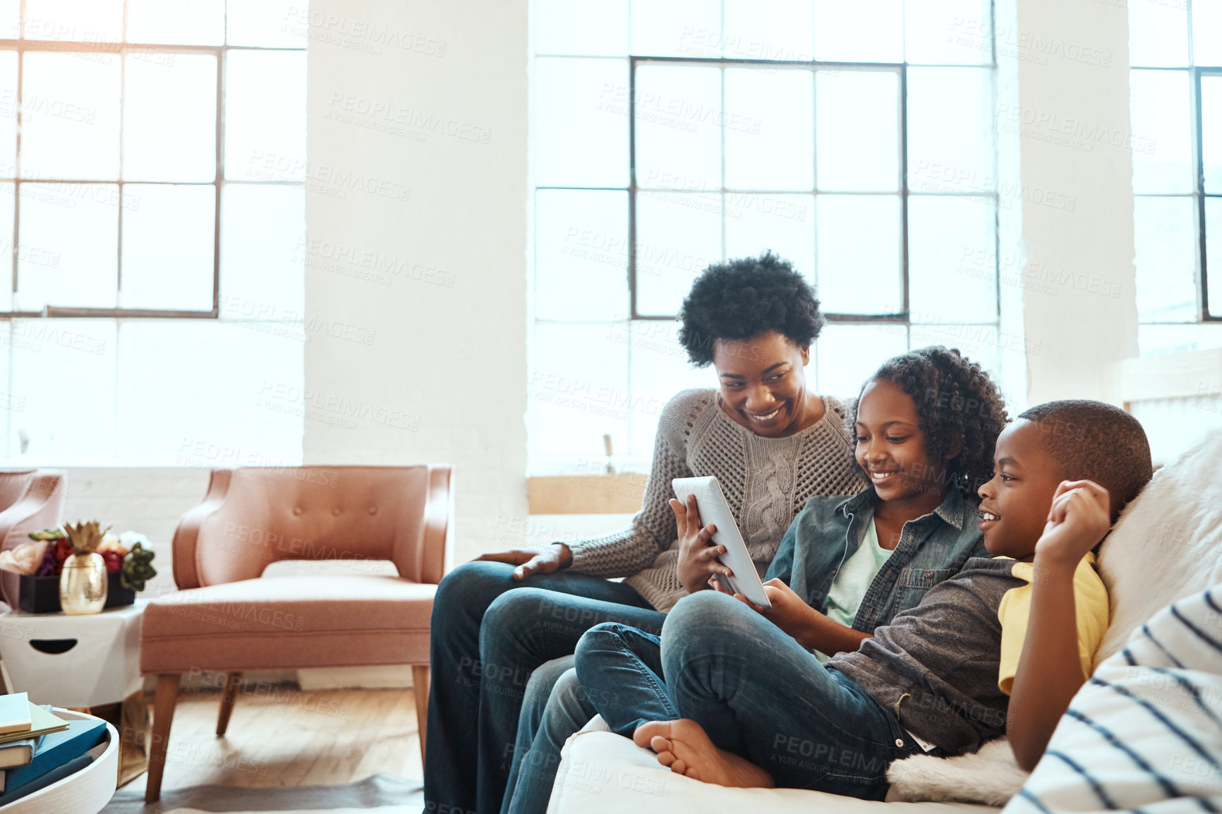 Buy stock photo Family with tablet, watch and relax at family home together, spending quality time together with technology. Black people, mother and children on sofa with device, internet wifi and social media