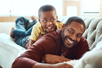 Buy stock photo Shot of a father and son at home