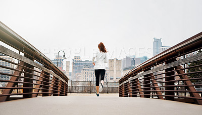 Buy stock photo Back, woman and runner by bridge in city, speed and endurance with fitness exercise in Germany. Training, female running and preparation for marathon, challenge or healthy living with workout outdoor