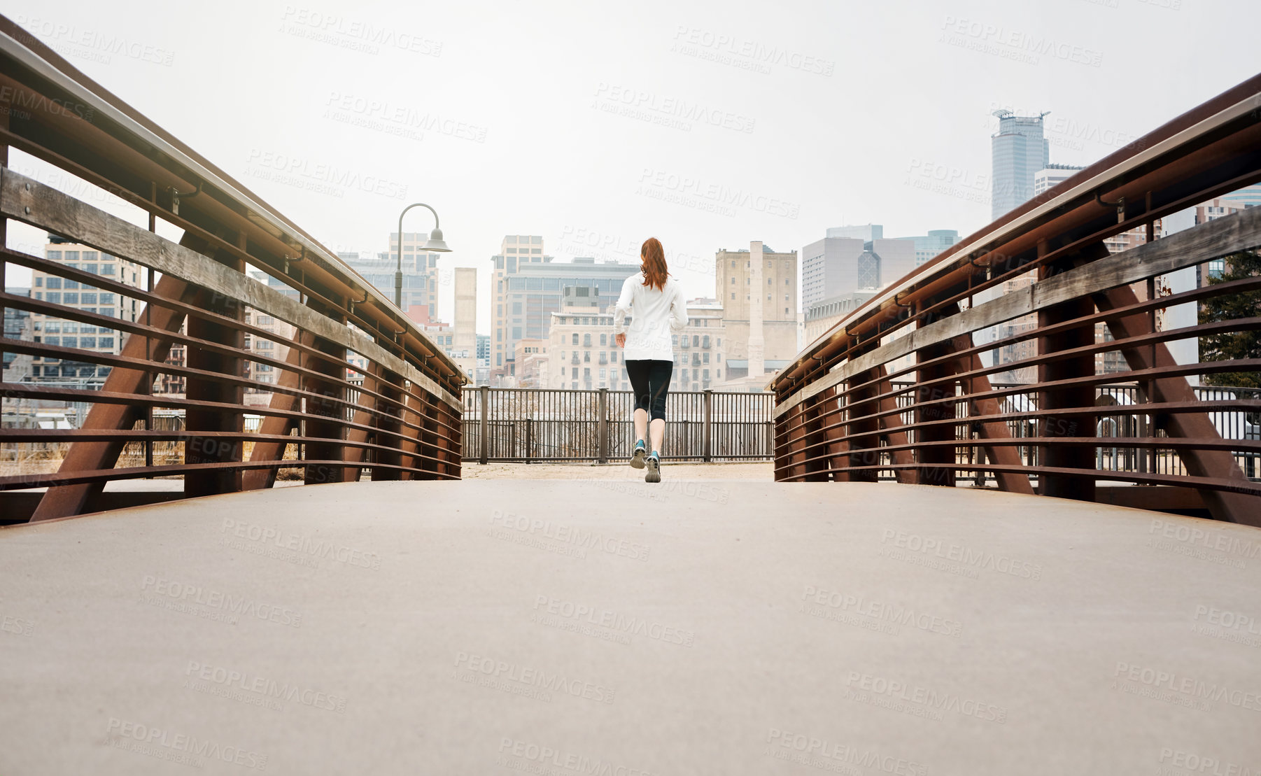 Buy stock photo Back, woman and runner by bridge in city, endurance and speed with fitness exercise Germany. Training, female running and preparation for marathon, challenge and healthy living with workout outdoor