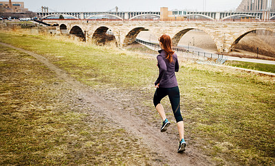 Buy stock photo Back, woman and running by bridge outdoor, endurance and speed with fitness in Germany. Training, female runner and preparation for marathon, challenge and exercise with workout in nature by mockup