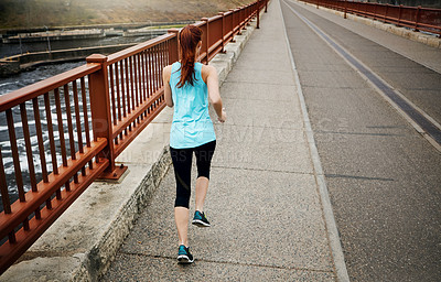 Buy stock photo Back, woman and running by bridge in road, endurance and speed with fitness exercise in Germany. Training, female runner and preparation for marathon, challenge or healthy living with workout outdoor