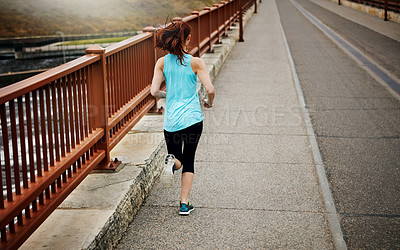 Buy stock photo Back, girl and running by bridge on road, endurance and speed with fitness exercise in Germany. Training, female runner and preparation for marathon, challenge and healthy living with workout outdoor