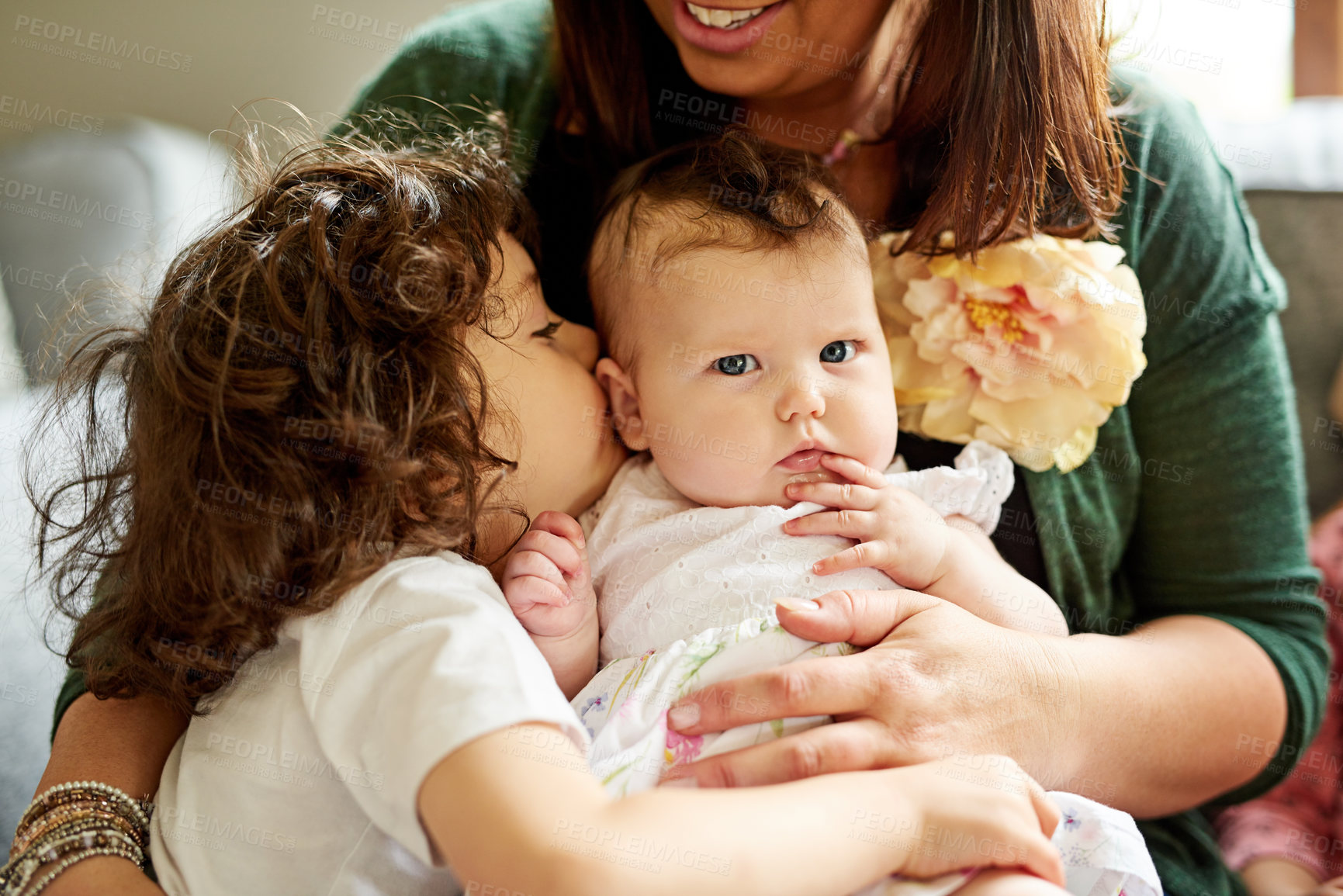 Buy stock photo Woman, home and sibling kissing baby with love for development, care and bonding together in morning. Happy family, child and infant with affection in living room for growth, support and connection