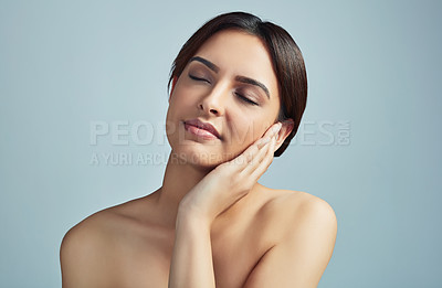 Buy stock photo Beauty, woman and skincare for confidence in studio for facial treatment, natural cosmetic and dermatology glow. Girl, relax and eyes closed with aesthetic change, healthy shine and gray background