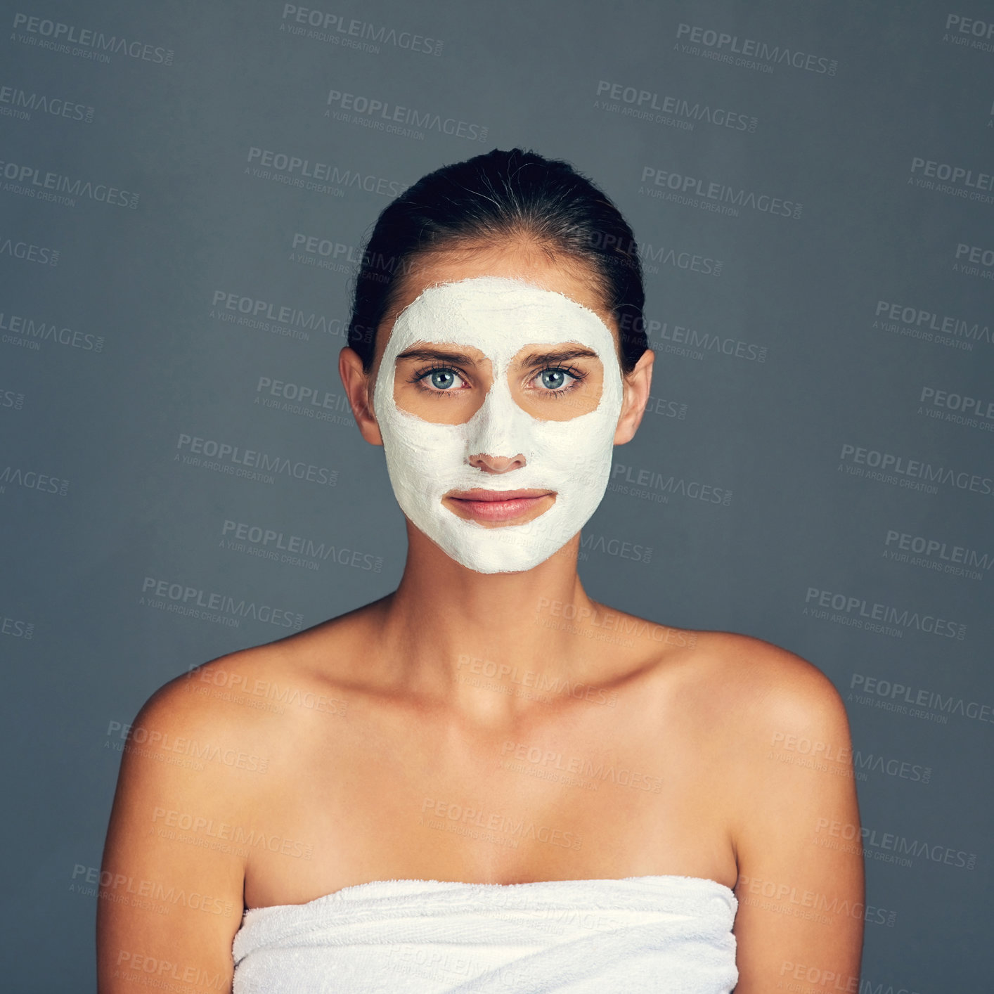 Buy stock photo Skincare, woman and portrait with face mask in studio for beauty, self care and cosmetics on gray background. Female person, serious and cream for facial, transformation and routine with detox