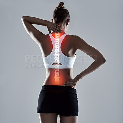 Buy stock photo Sports injury, woman and spinal cord for fitness, workout and wellness in studio with red glow. Pain, athlete and spine with stress for training, exercise and uncomfortable strain on gray background
