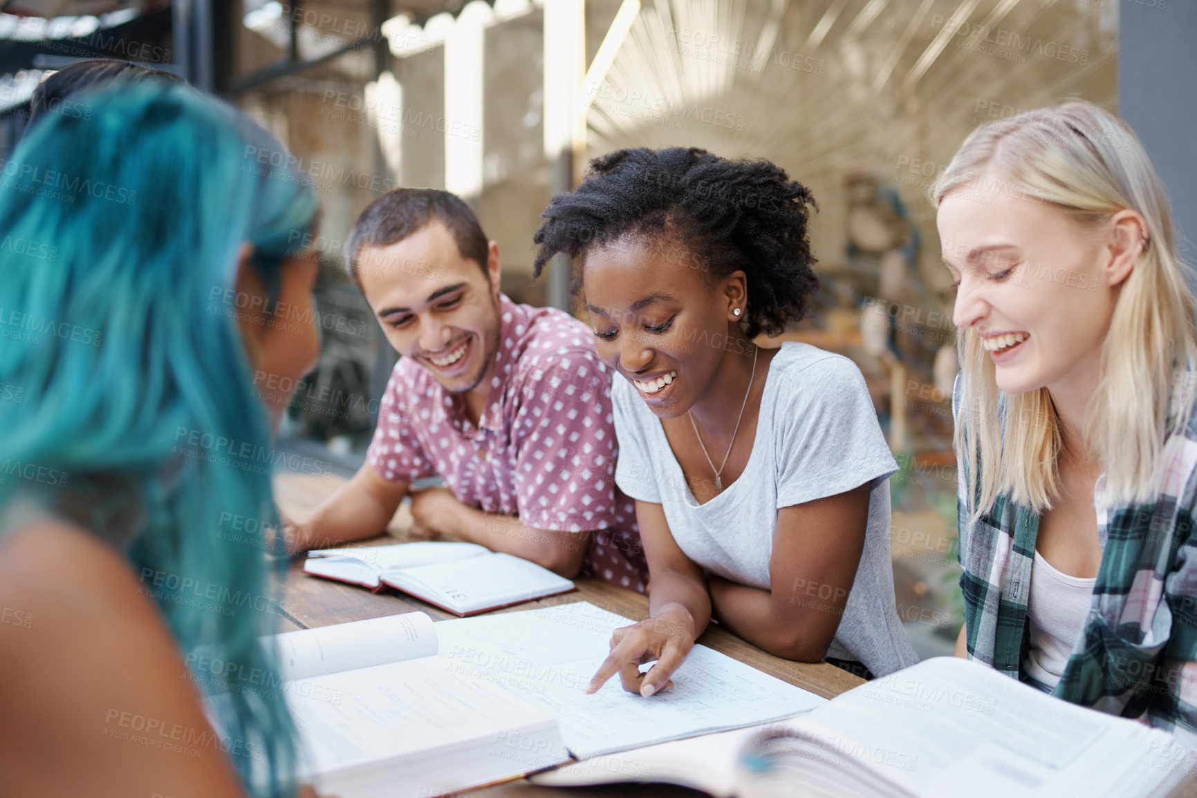 Buy stock photo Students, friends and study outdoor at university with books, laptop and learning for education and campus. Group, gen z people and teamwork research with smile, diversity and college break by table