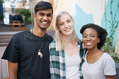 Buy stock photo Shot of a group of happy young friends spending time together outside