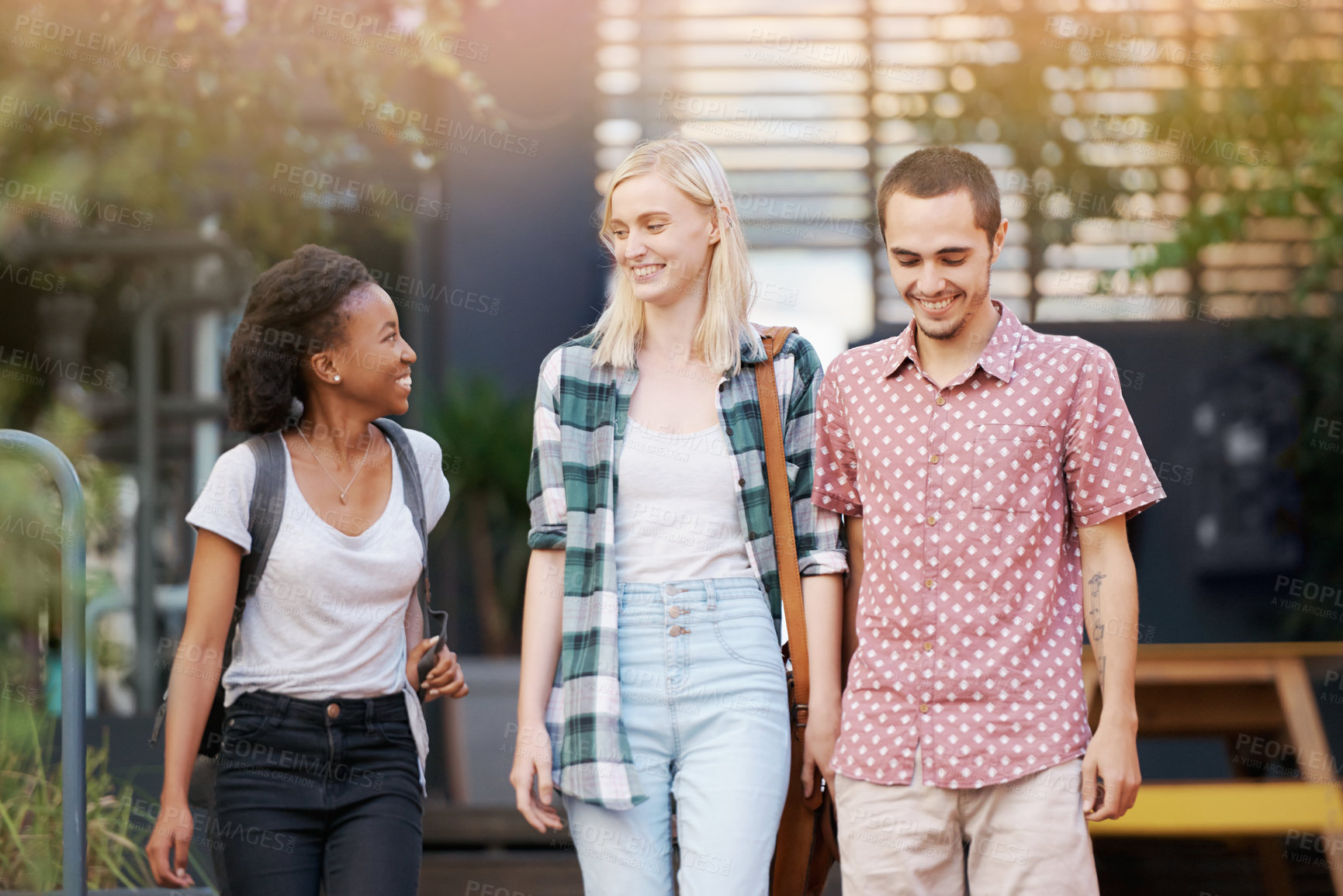 Buy stock photo Walking, talk and young students at university planning for study, assignment or test with scholarship. Networking, discussion and young women with bags bonding and conversation at college campus.
