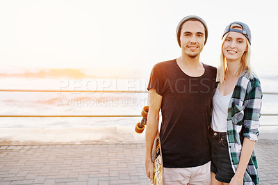 Buy stock photo Couple, skateboard and happy on beach for fun with mockup space, adventure and promenade date. Gen z skater, people and portrait on boardwalk for bonding, embrace and outdoor travel with sea sunset
