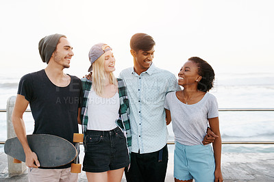 Buy stock photo Group, friends and happy for hug on promenade by ocean for diversity, bonding or care on holiday. Men, women or gen z people with smile, embrace and outdoor on boardwalk for youth culture on vacation