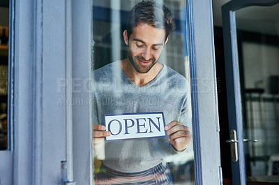 Buy stock photo Cropped shot of a handsome young cafe owner