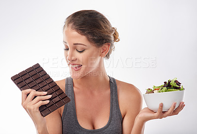 Buy stock photo Woman, chocolate and salad with choice for diet, weight loss and balance with snack comparison on white background. Nutrition, vegetables and candy with unhealthy versus healthy food for benefits