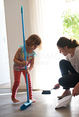 Buy stock photo Broom, sweeping and mother with girl in home for chores, helping and learning hygiene routine. Housekeeping, mom and daughter cleaning dust on floor together with support, care and child development