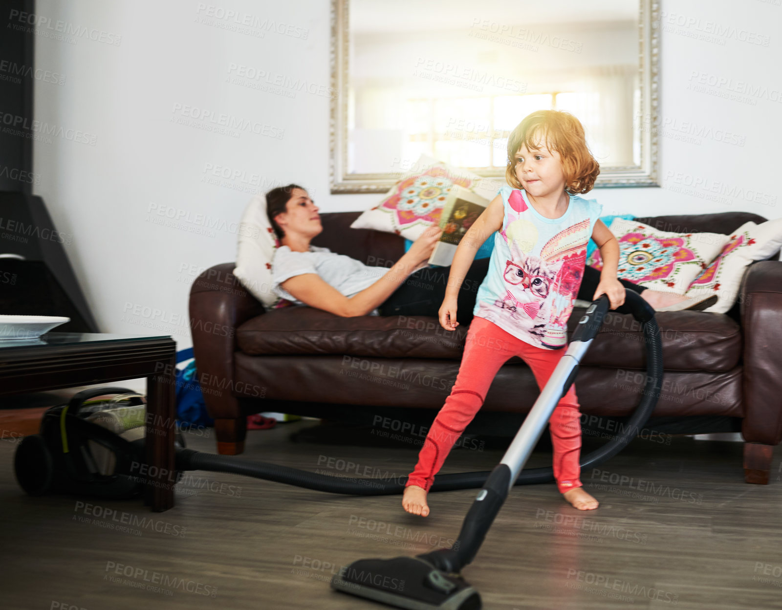 Buy stock photo Home, kid and cleaning or playing with vacuum for child development, growth and childhood memories. Parent, girl and enjoy in living room with imitation, fun and educational for social learning