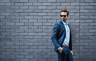Buy stock photo Businessman, sunglasses and confidence in fashion by wall with pride for career, mockup space or professional. Corporate, employee or shades with suit, smart casual or eyewear for creative occupation