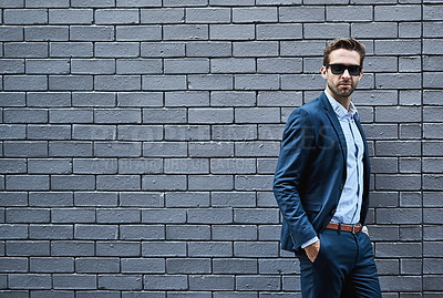 Buy stock photo Business man, fashion and sunglasses on ceo, boss or executive against wall background in city for success, wealth and goals. Professional urban male outdoor in formal, luxury or designer clothes