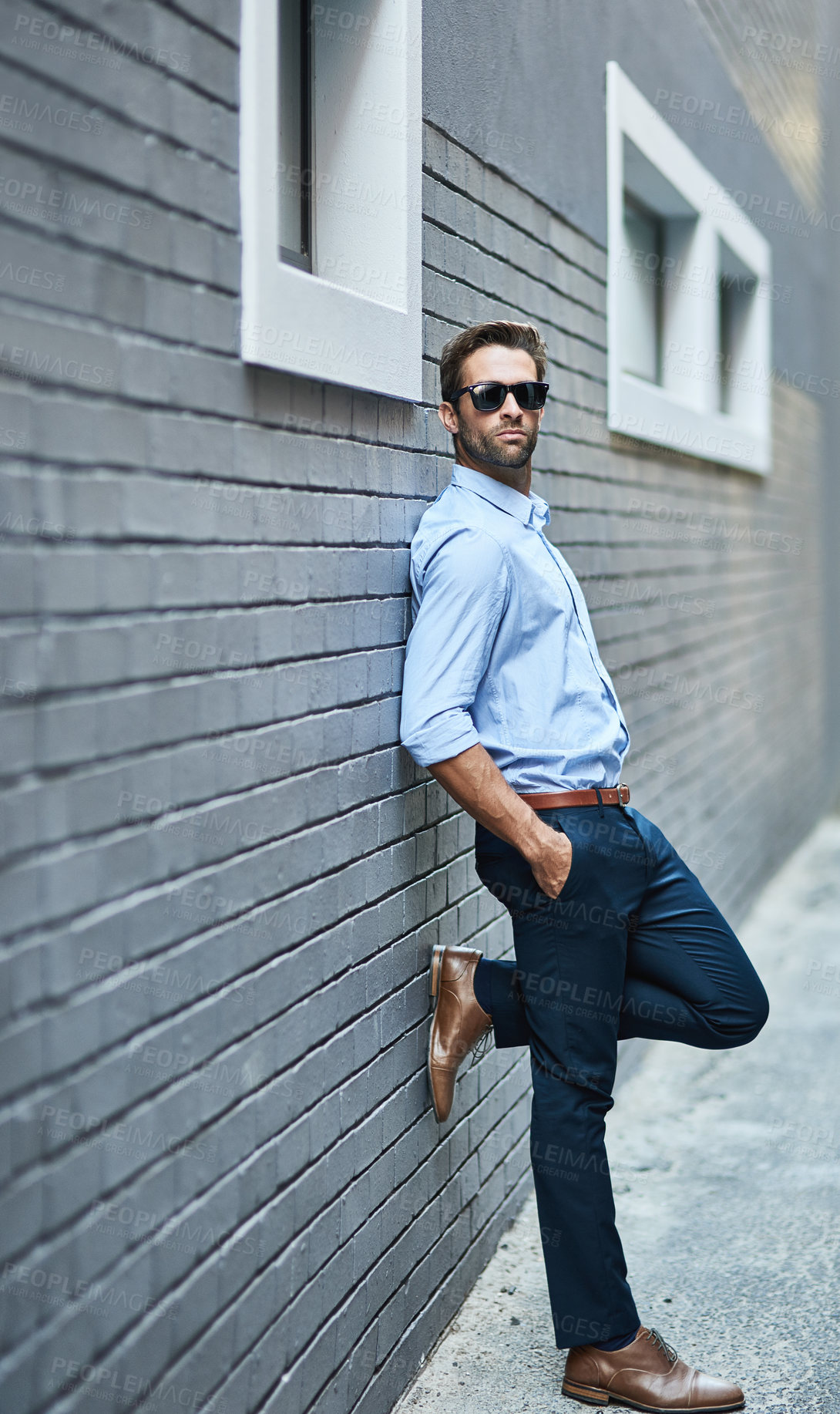 Buy stock photo Man, brick and wall with vision, confidence and sunglasses with urban background. Consultant, startup and business with ambition, style and formal or professional aesthetic for corporate fashion