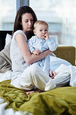 Buy stock photo Sad, depression and mother with child in bedroom has fear and stress about infant development in a house. Baby, postpartum and mom in bed is tired from insomnia due to mental health and problem.