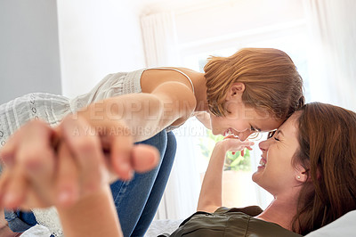 Buy stock photo Shot of a young mother and her daughter at home