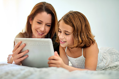 Buy stock photo Smile, mother and child on tablet in bed at home together for game, relax and family streaming movie. Happy girl, mom and technology in bedroom for learning, education or reading ebook on app online