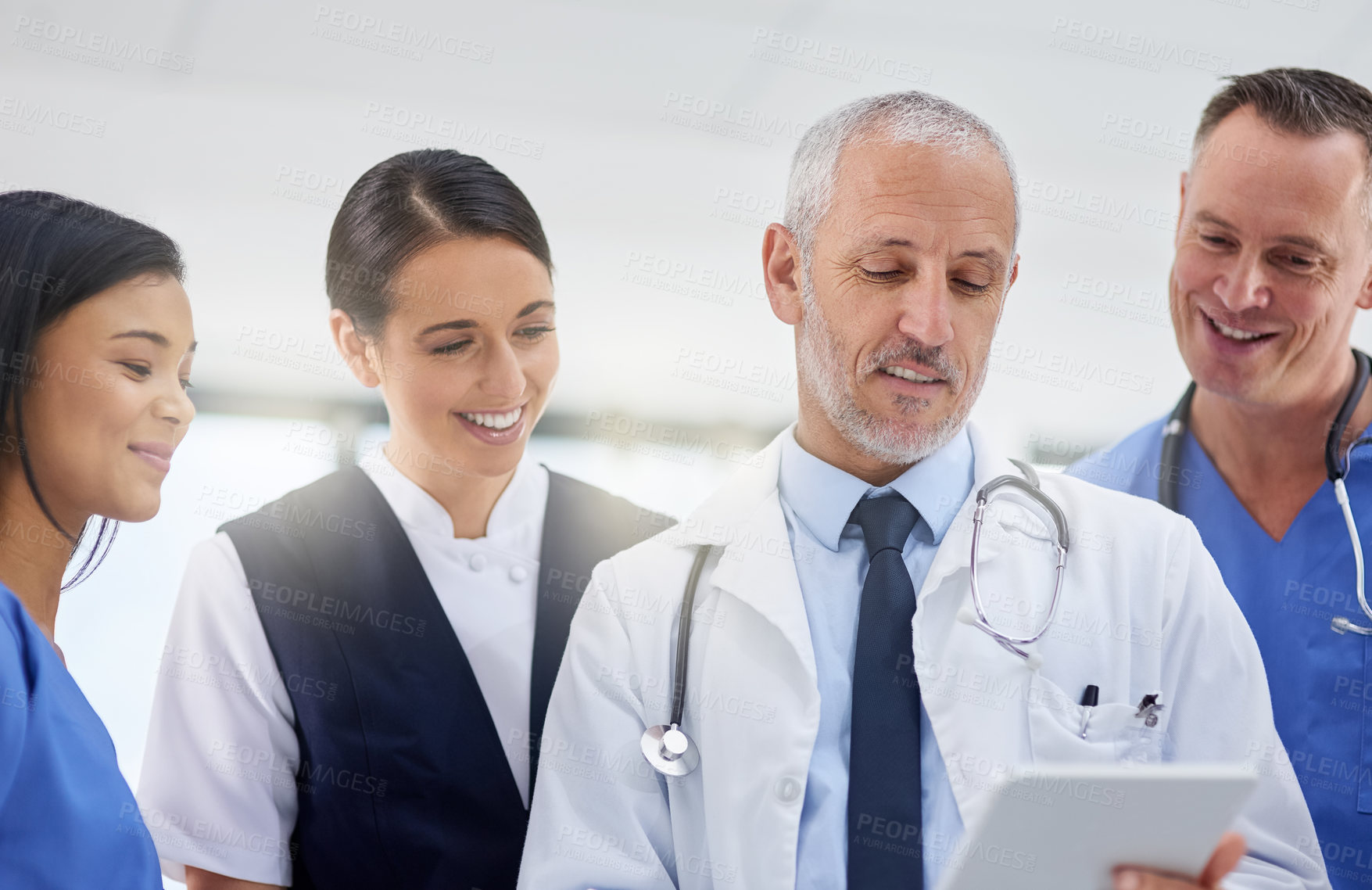 Buy stock photo Conversation, tablet and medical team in a hospital with a mature manager with healthcare workers with tech. Clinic, cardiology research and digital report with good news and collaboration at job