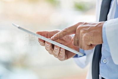 Buy stock photo Hospital, online and hands of doctor on tablet for medical website, telehealth and internet research. Healthcare, clinic and person on digital tech for consulting service, wellness app and contact