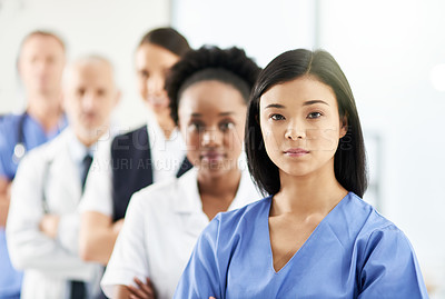 Buy stock photo Teamwork, portrait of doctors and nurses in hospital, support and team work in healthcare. Health, diversity and medicine, serious woman doctor and group of medical employees standing in row together