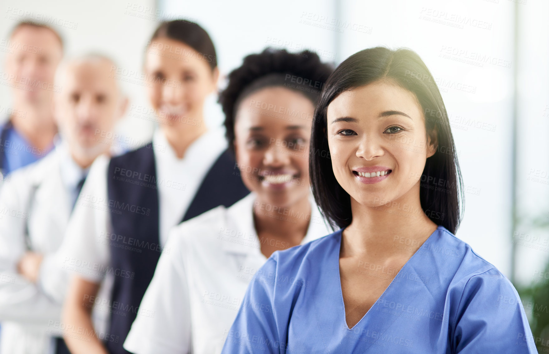 Buy stock photo Smile, team and portrait of doctors and nurses in hospital, support and teamwork in healthcare. Health, help and medicine, confident woman doctor and group of happy medical employees in row together.