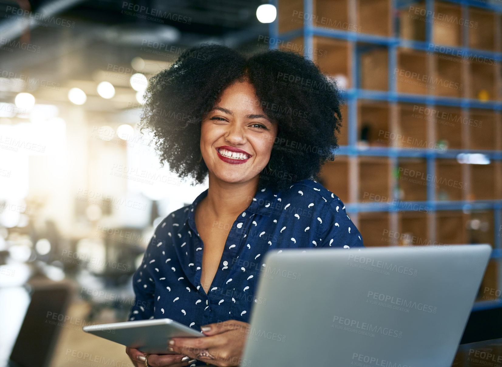 Buy stock photo Shot of a young female designer working in her office