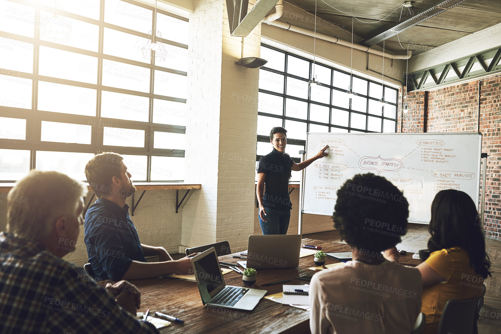 Buy stock photo Shot of a group of colleagues having an office meeting inside