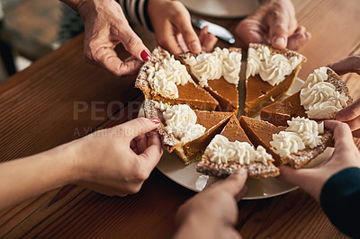 Buy stock photo Party, pumpkin pie and hands of people at table for thanksgiving, celebration and festive holiday. Food, dessert and community with family and dinner for event, traditional and social gathering