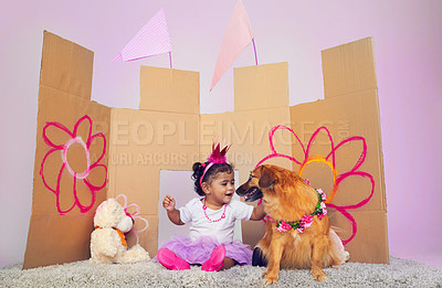 Buy stock photo Little girl, princess and dog with castle for fairy tale, make belief or dream with imagination at home. Happy child, toddler or baby playing with pet for game, fantasy or cosplay in costume at house