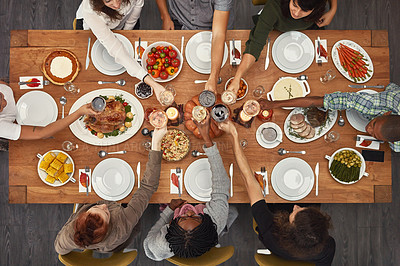 Buy stock photo Food, top view and friends toast at a table in celebration of thanksgiving at a party or social event together. Cheers, support and happy people with diversity, support and trust enjoy a dinner meal