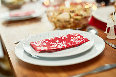 Buy stock photo Christmas, celebration and holiday table plate for food, party and dining place setting zoom. Dining room, lunch or dinner to celebrate xmas vacation with festive red snowflake napkin.

