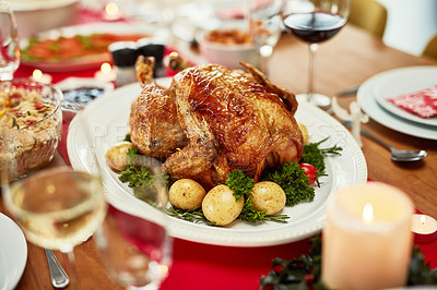 Buy stock photo Thanksgiving, turkey and food with a meal on a dining room table for tradition in an empty room. Christmas, chicken and dinner of a place setting for a celebration even in a home or house closeup