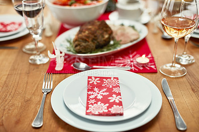 Buy stock photo Wine glass, plate and cutlery on the table at a christmas party or event in the dining room of a house. Napkin, table setting and dinner party for a festive xmas holiday lunch celebration at a home.