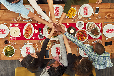Buy stock photo Hands, unity and Christmas with a table setting for dinner or a celebration even with friends from above. Food, together and motivation with a group of people bonding during a meal in the holidays