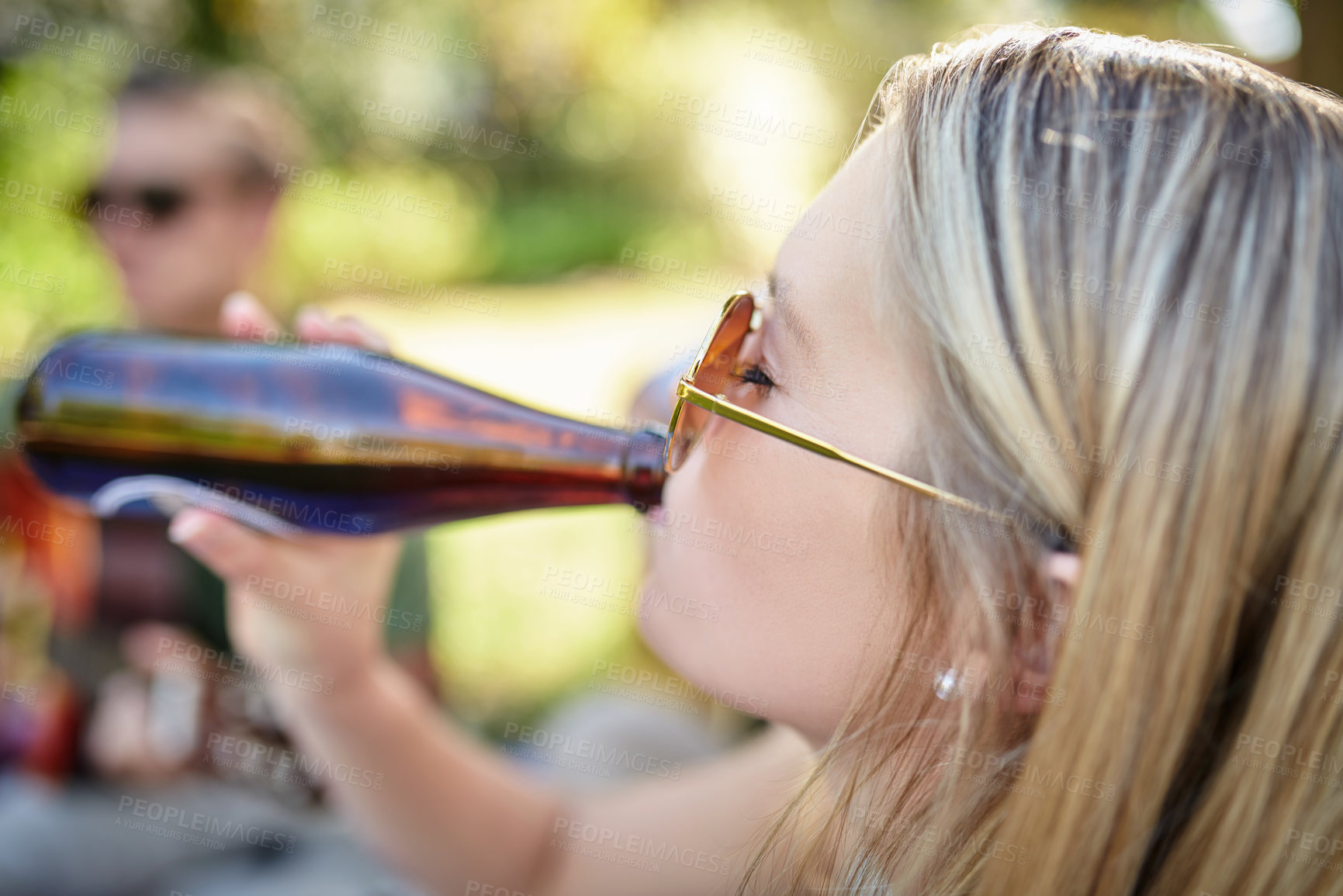 Buy stock photo Beer, drinking and face of woman outdoor in nature with friends for party or picnic in summer. Alcohol, bottle and sunglasses with person in park for celebration or social gathering on weekend