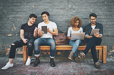 Buy stock photo Shot of a diverse group of people social networking outside