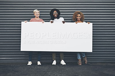 Buy stock photo Diverse women holding blank poster, copy space board and placard sign to promote, market and advertise opinion and female empowerment. Group portrait of women endorsing with billboard in city