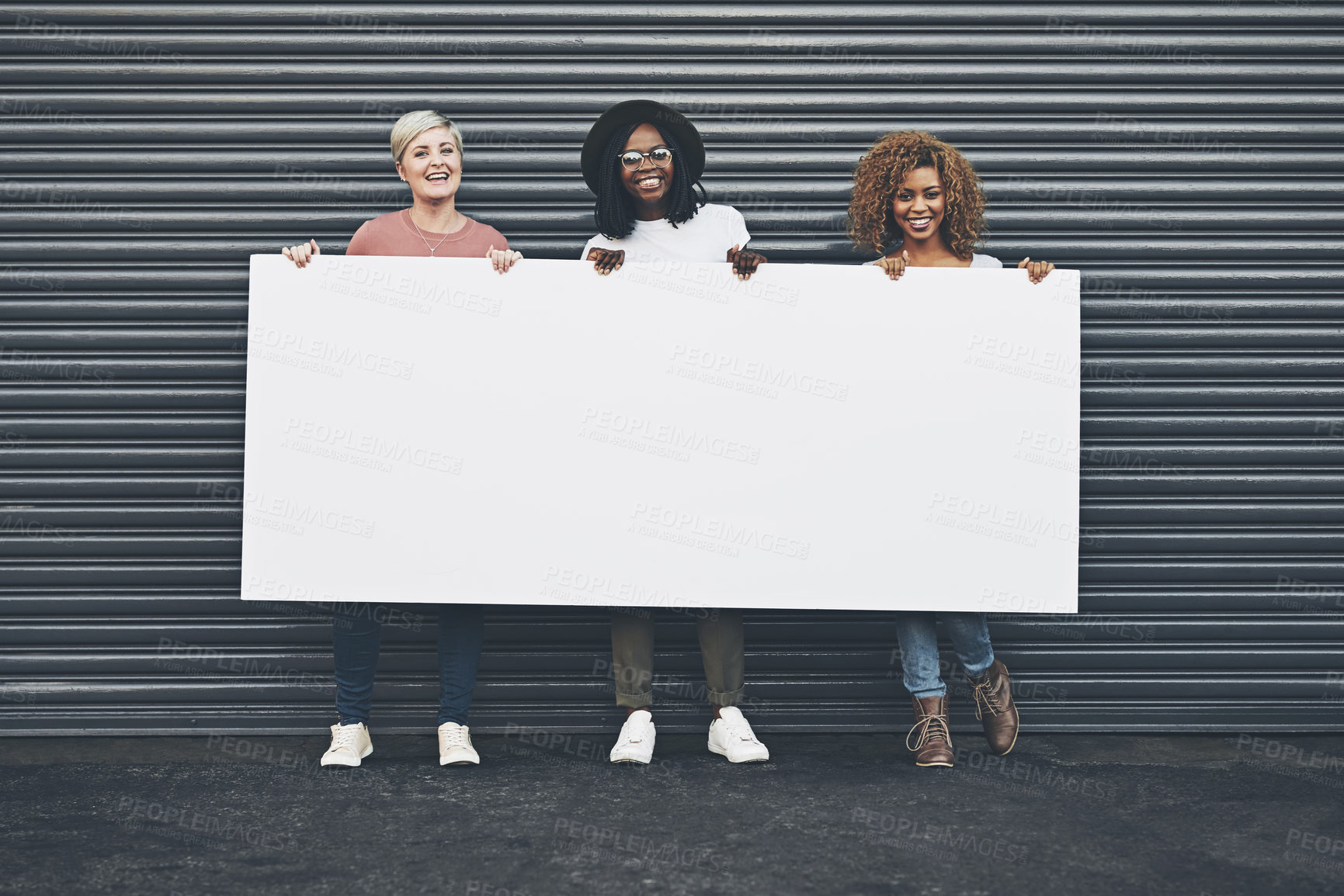 Buy stock photo Diverse women holding blank poster, copy space board and placard sign to promote, market and advertise opinion and female empowerment. Group portrait of women endorsing with billboard in city