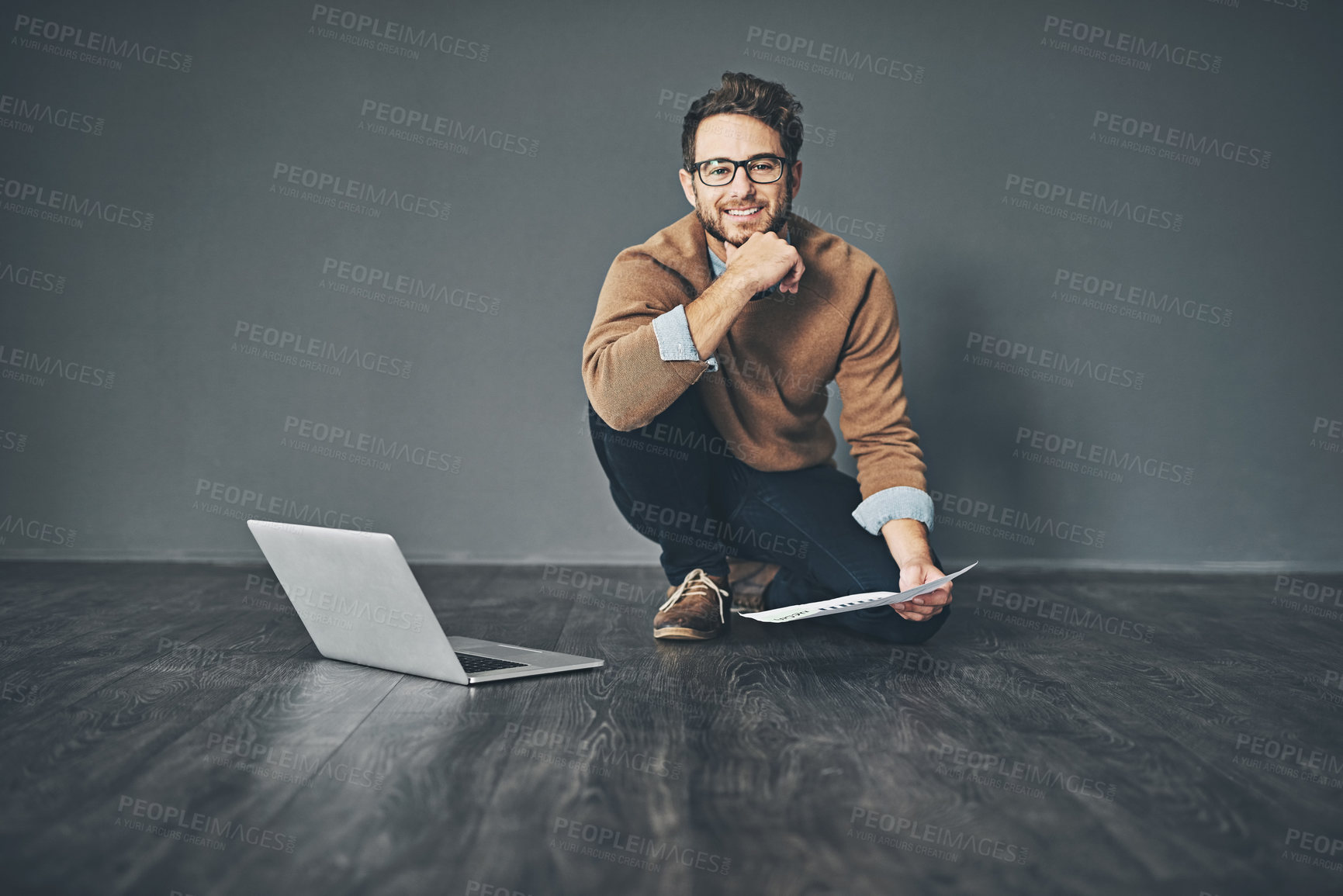 Buy stock photo Office, floor and portrait of businessman with paper by laptop for interior design, research or plan. Document, info and face of male person with technology for renovation project, feedback or review