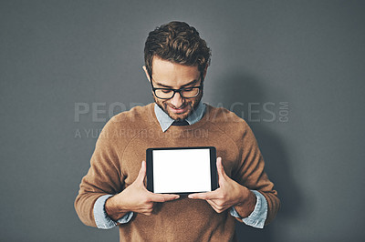 Buy stock photo Person holding copyspace, blank and empty tablet screen with an internet app in studio against a grey background. Advertising, marketing and endorsing a product, service or website with copy space